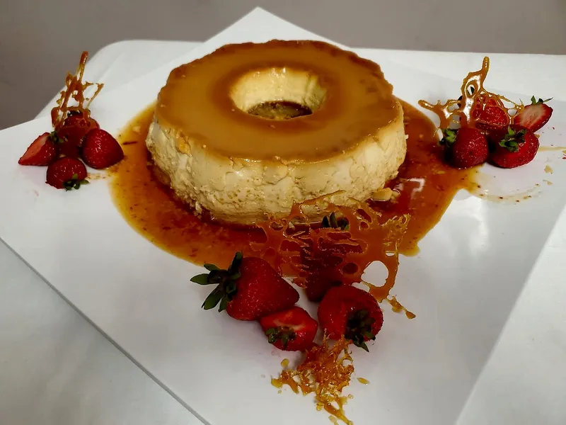 Crema volteada crowned with fresh strawberries