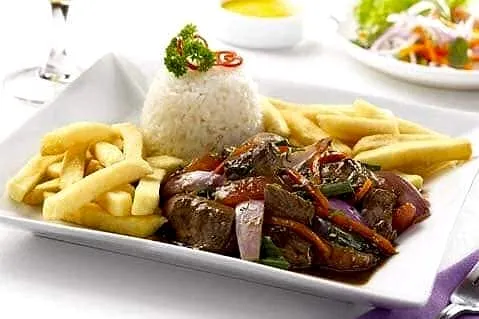 Lomo saltado with golden fries and white rice