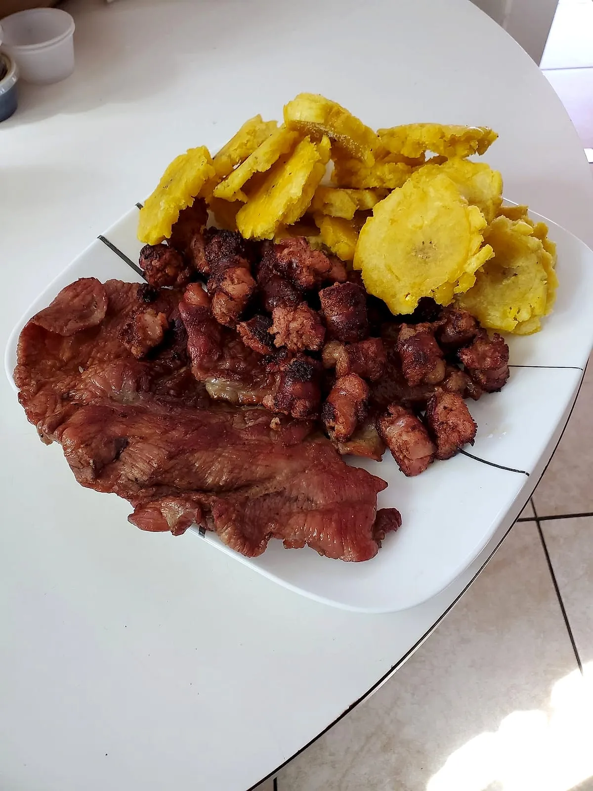 Homestyle cecina plate with tostones