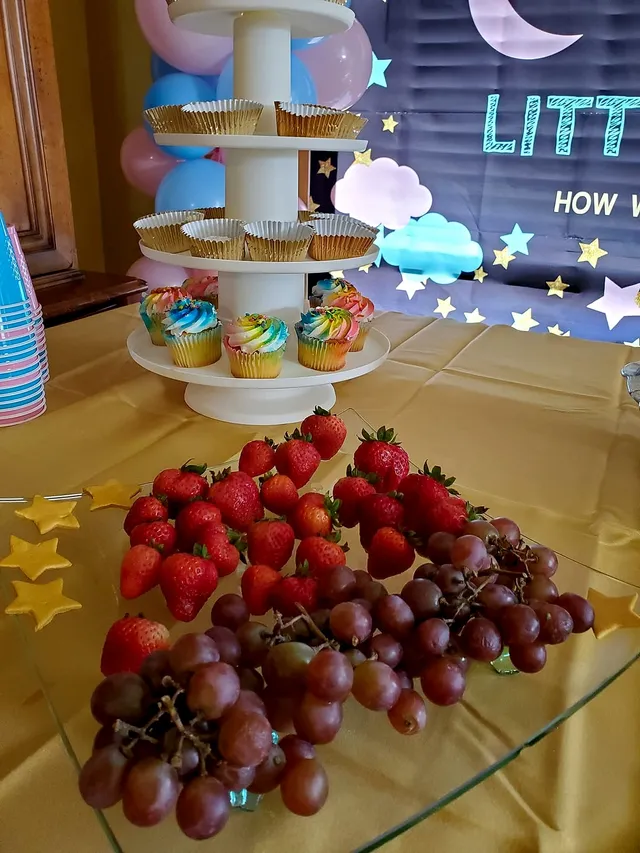Tiered dessert table with sweets at a decorated party